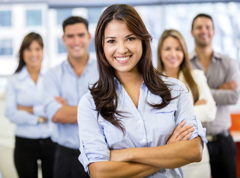 Businesswoman leading a business team and smiling